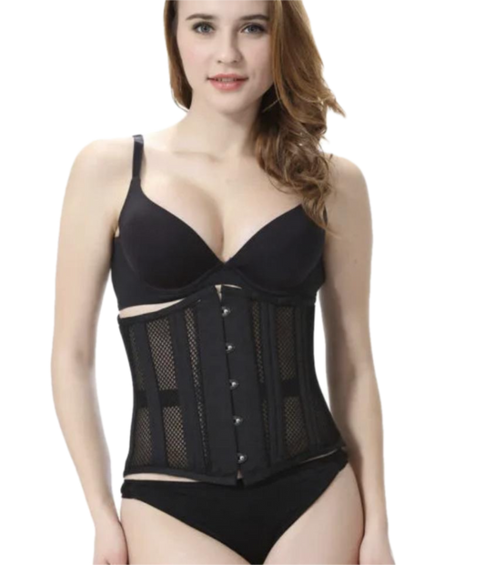 Woman wearing a black corset for waist cinching and posture support, standing confidently
